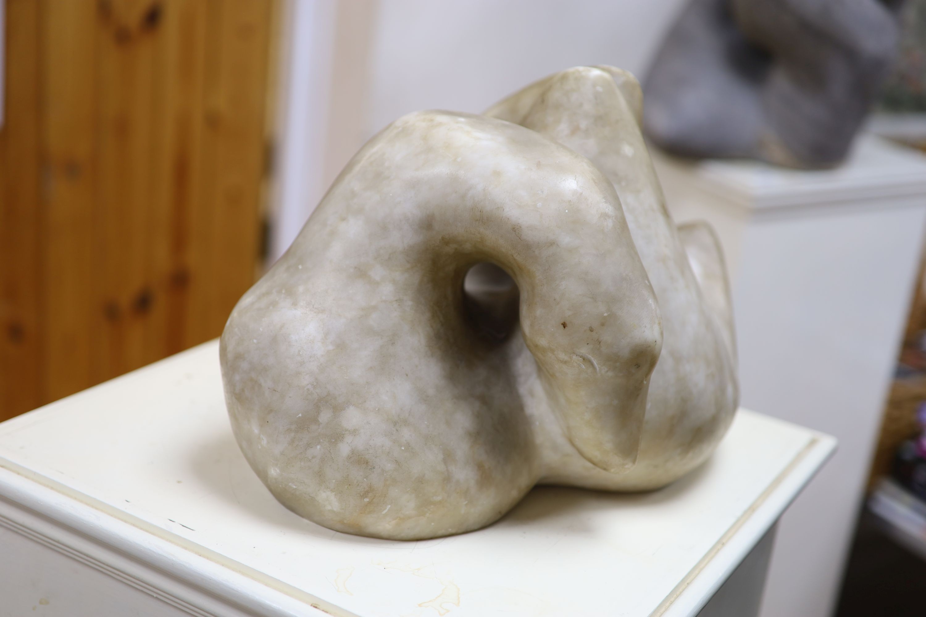 Wilby Hart, alabaster sculpture, abstract form, W. 33cm. H 32cm., on a painted wood pedestal.